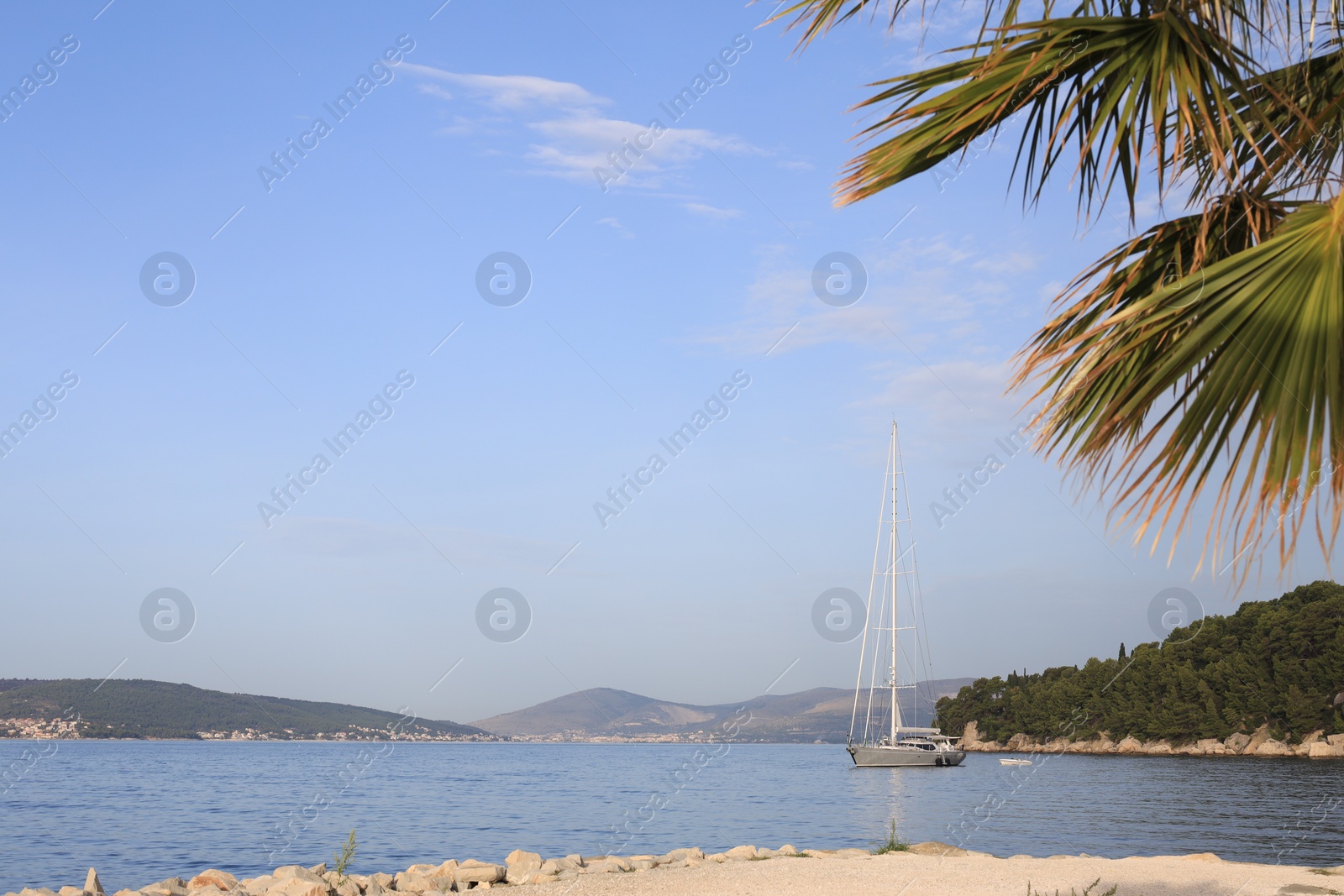 Photo of Beautiful view of tranquil sea and yacht on summer day