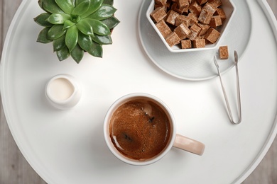 Photo of Creative flat lay composition with delicious hot coffee on table