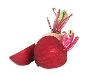 Photo of Whole and cut ripe beetroots on white background