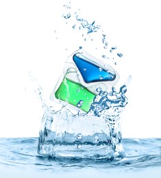 Image of Laundry capsule falling into water on white background. Detergent pod