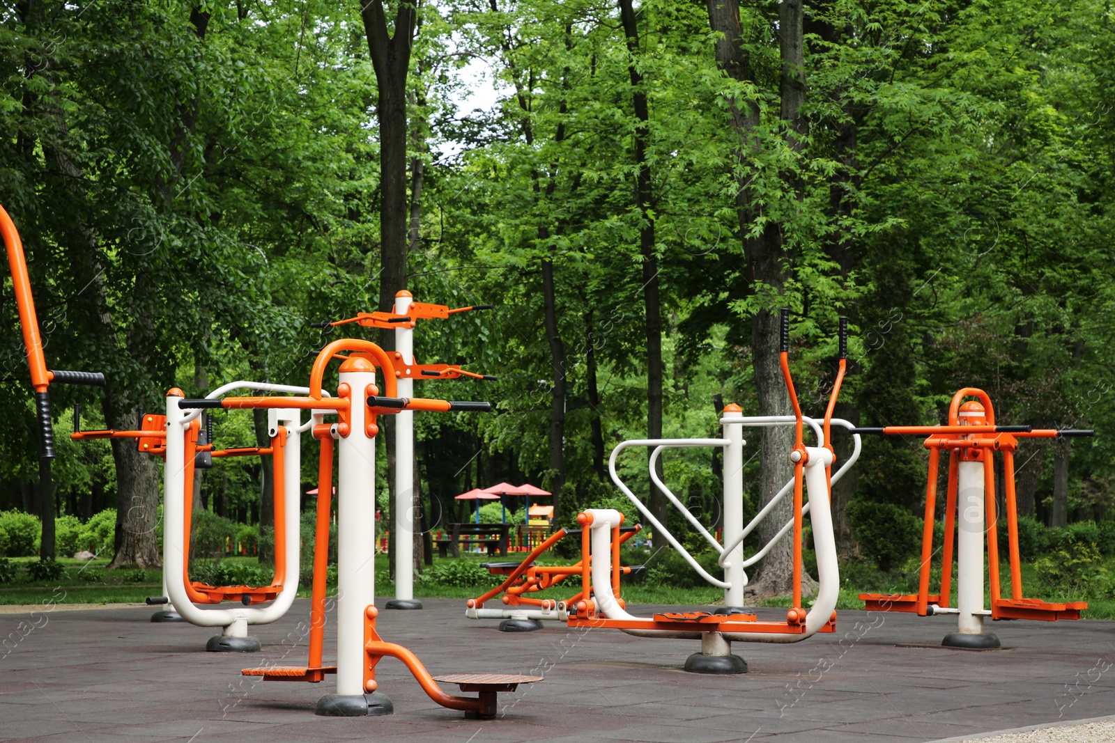 Photo of Empty outdoor gym with double abductor, twister, air walker and push up bars