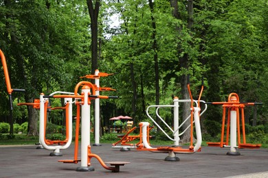 Empty outdoor gym with double abductor, twister, air walker and push up bars