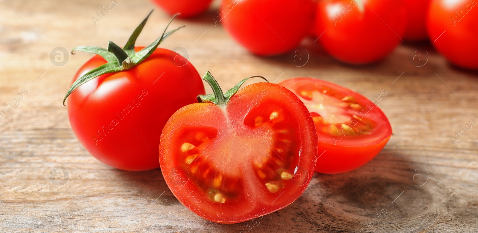 Image of Fresh cherry tomatoes on wooden table. Banner design 