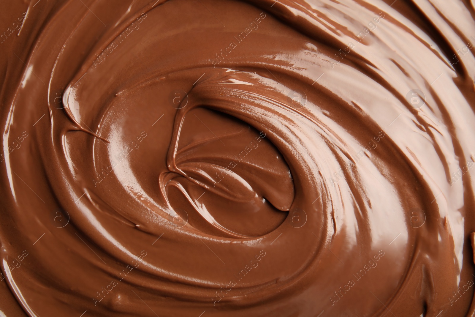 Photo of Sweet tasty chocolate cream as background, closeup