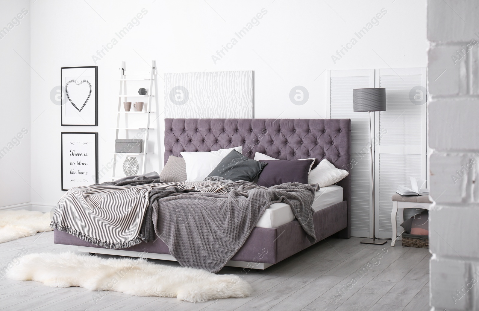 Photo of Bedroom interior with comfortable soft bed