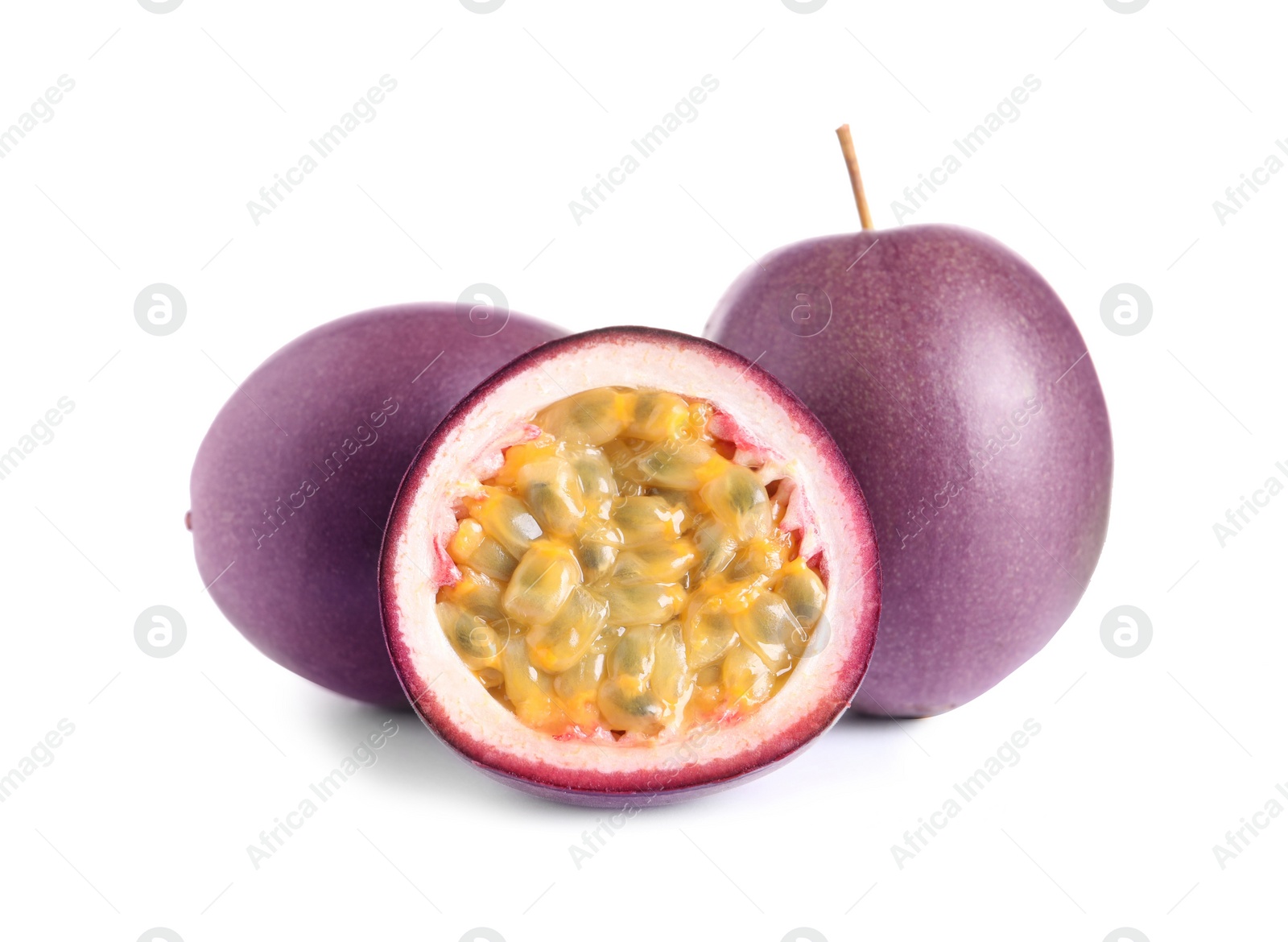 Photo of Cut and whole passion fruits isolated on white