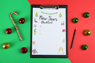 Photo of New Year Checklist. Flat lay composition with clipboard and festive decor on color background