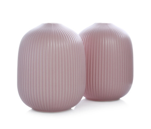 Stylish empty pink ceramic vases isolated on white