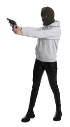 Woman wearing knitted balaclava with gun on white background