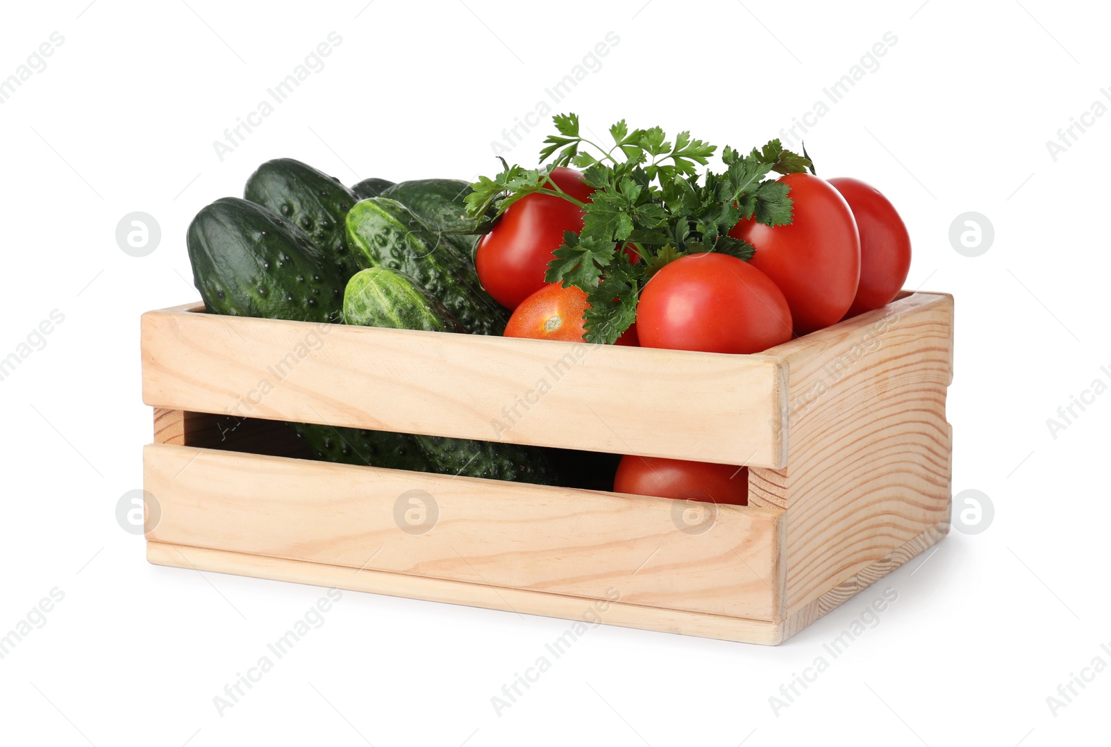 Photo of Wooden crate full of fresh vegetables on white background