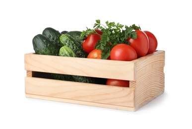 Wooden crate full of fresh vegetables on white background