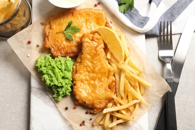 British traditional fish and potato chips on table, top view