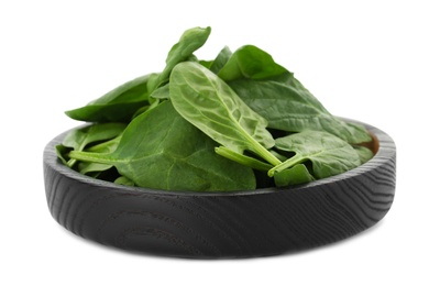 Bowl of spinach leaves isolated on white