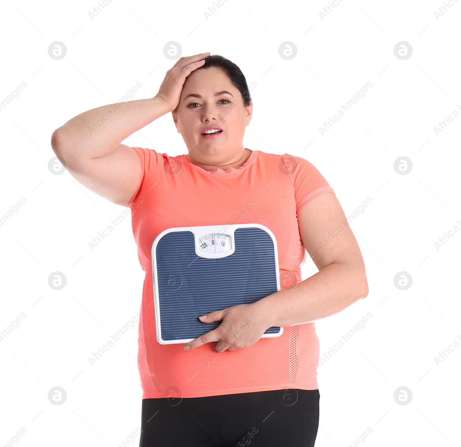 Photo of Overweight woman in sportswear with scales on white background