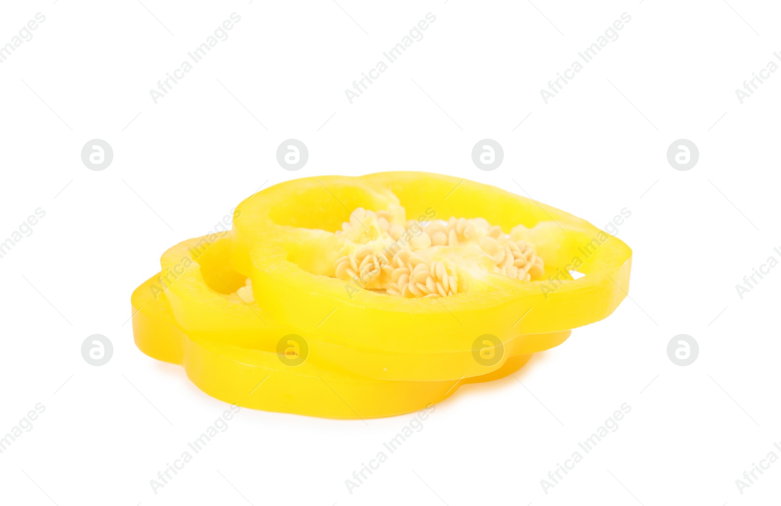 Photo of Slices of yellow bell pepper with seeds isolated on white