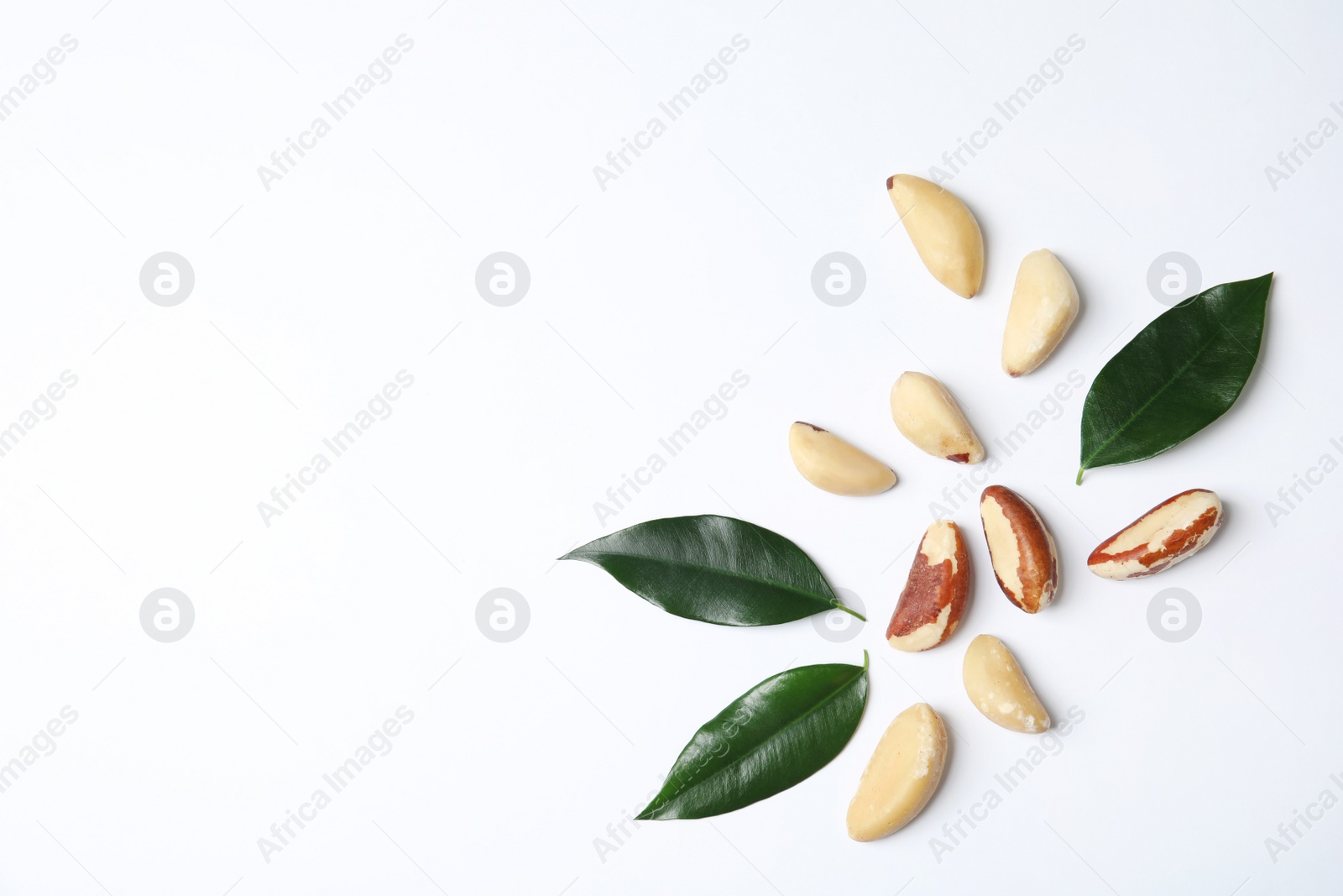 Photo of Composition with Brazil nuts and space for text on white background, top view