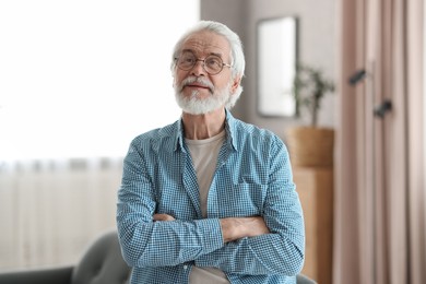 Photo of Portrait of happy grandpa with glasses indoors