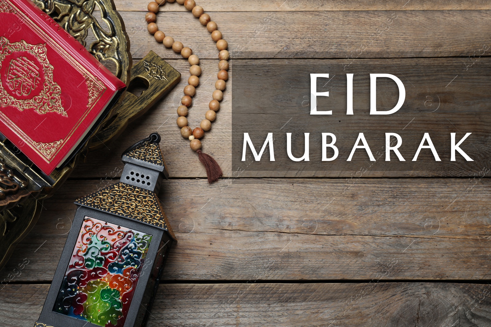 Image of Eid Mubarak greeting card. Arabic lantern, Quran and misbaha on wooden background, flat lay