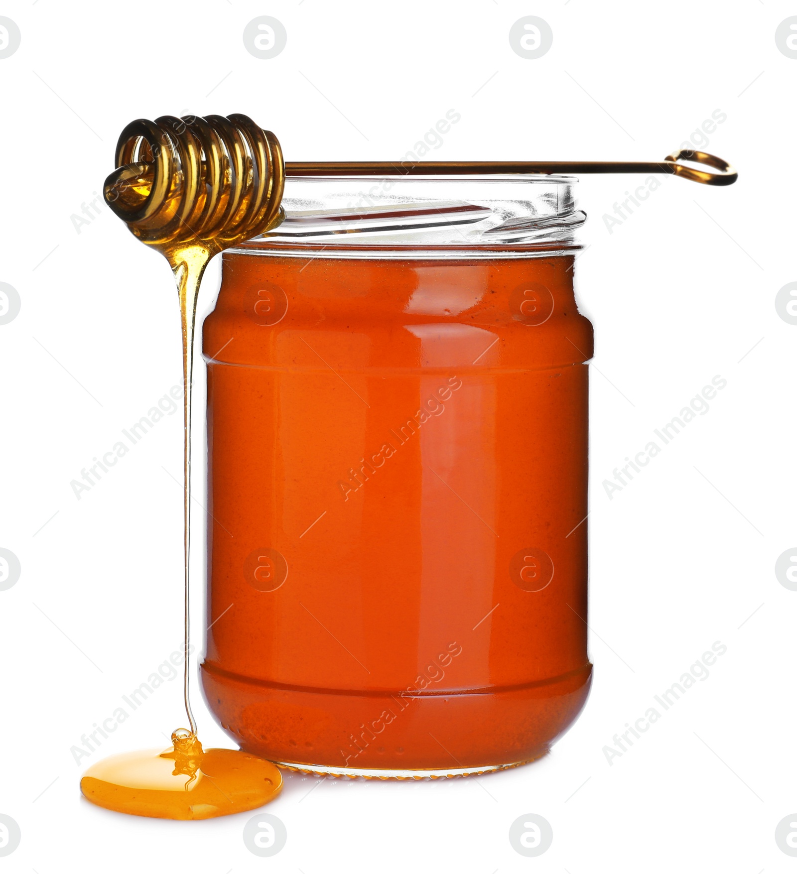 Photo of Jar of organic honey and dipper isolated on white