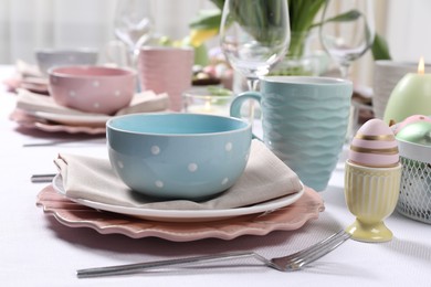 Photo of Festive table setting with elegant dishware, closeup. Easter celebration