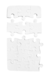 Image of Set with jigsaw puzzle pieces on white background, top view