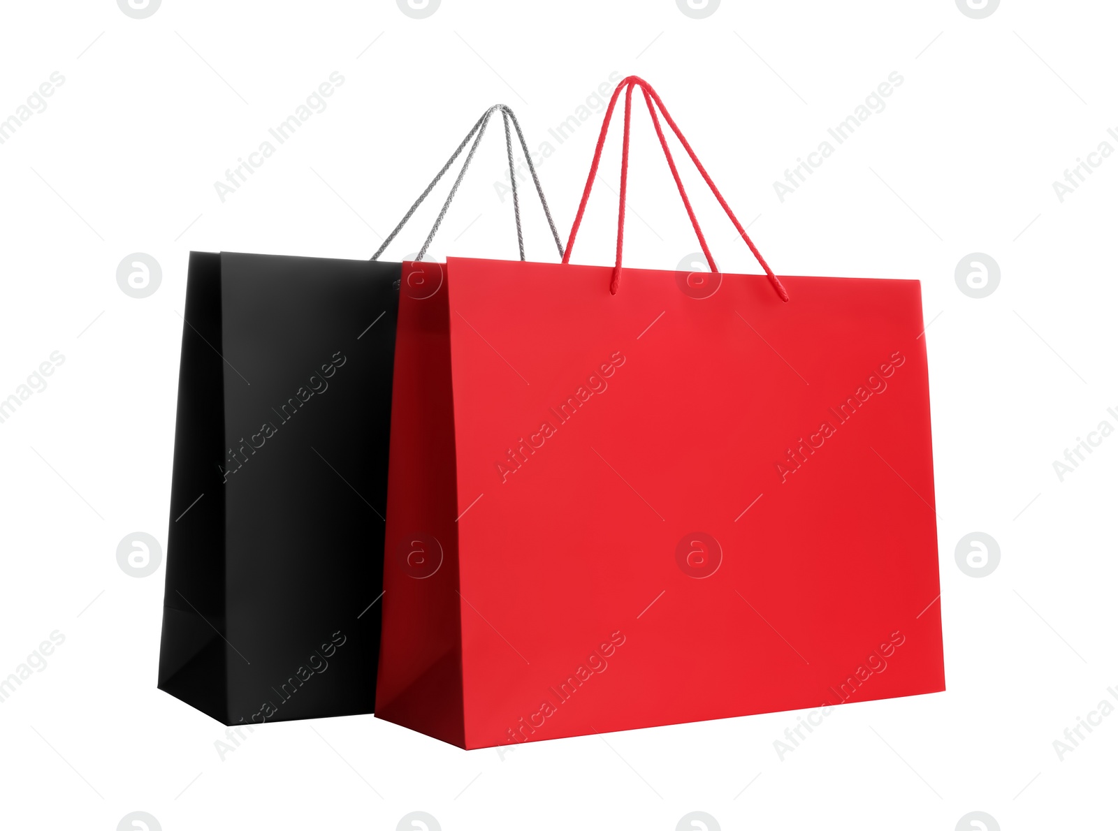 Photo of Different paper shopping bags isolated on white