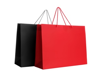 Photo of Different paper shopping bags isolated on white