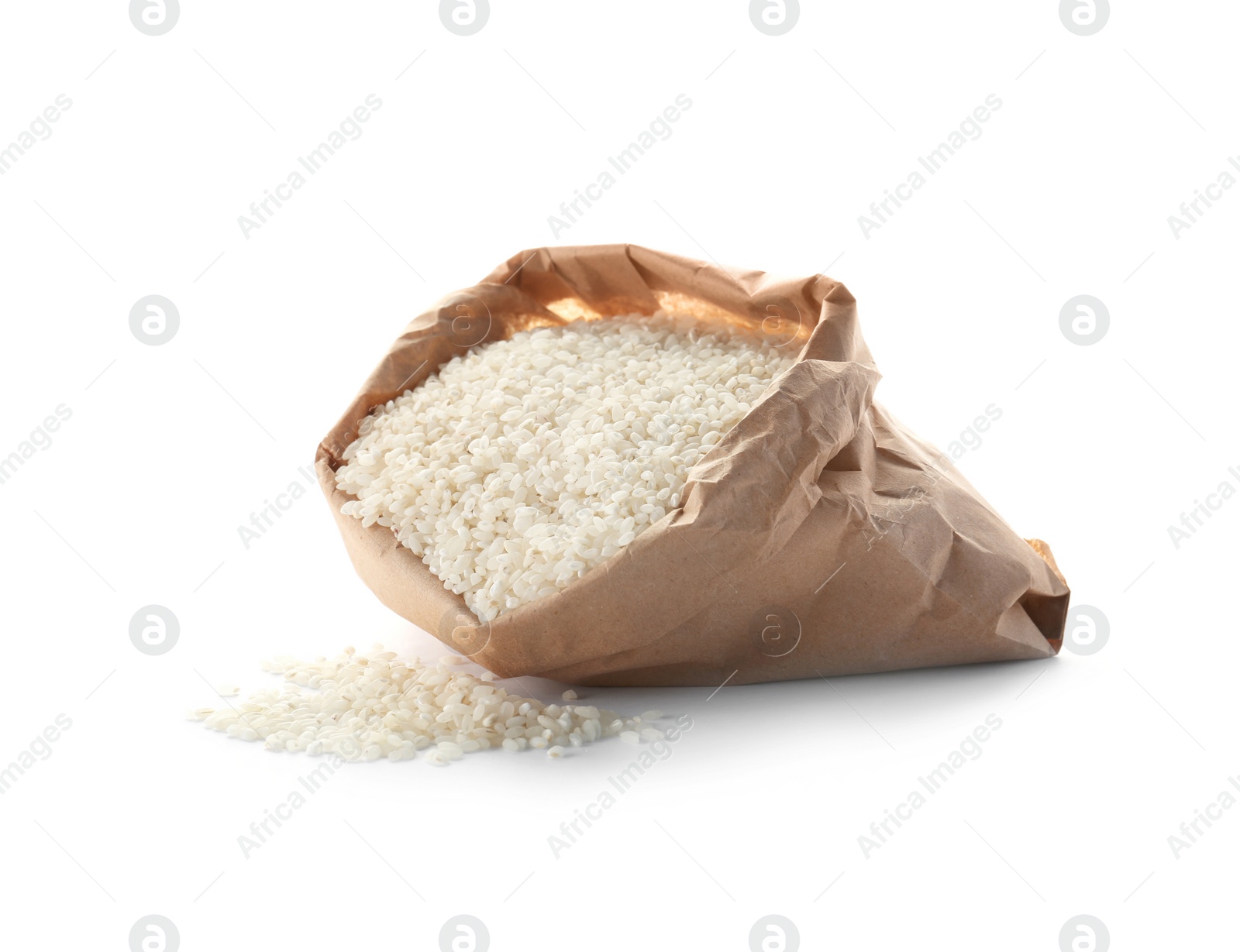 Photo of Paper bag with raw rice on white background. Healthy grains and cereals