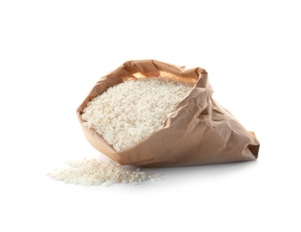 Photo of Paper bag with raw rice on white background. Healthy grains and cereals