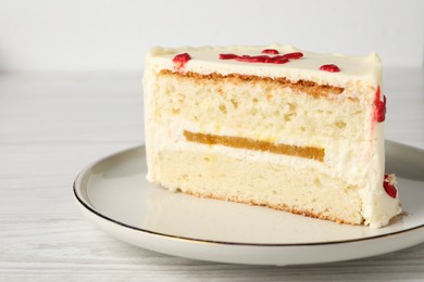 Photo of Cut bento cake on white wooden table, closeup. St. Valentine's day surprise