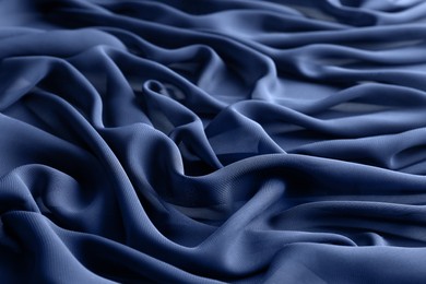 Beautiful dark blue tulle fabric as background, closeup