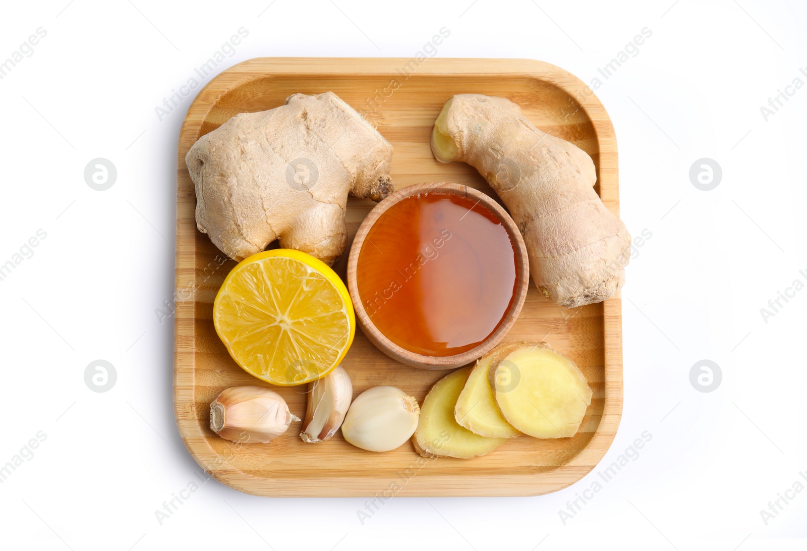 Photo of Fresh garlic and other natural cold remedies isolated on white, top view