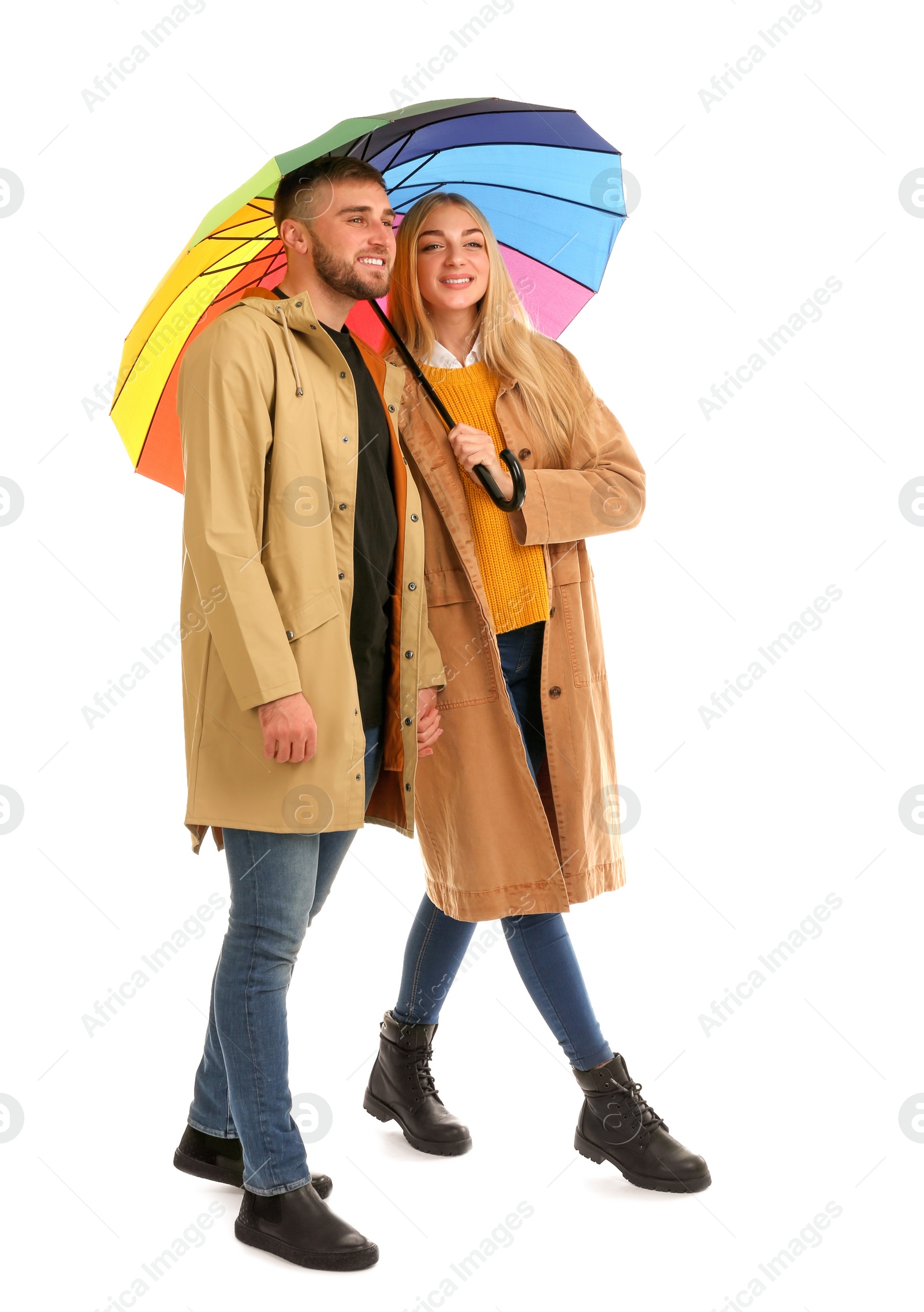 Photo of Full length portrait of beautiful couple with umbrella, isolated on white