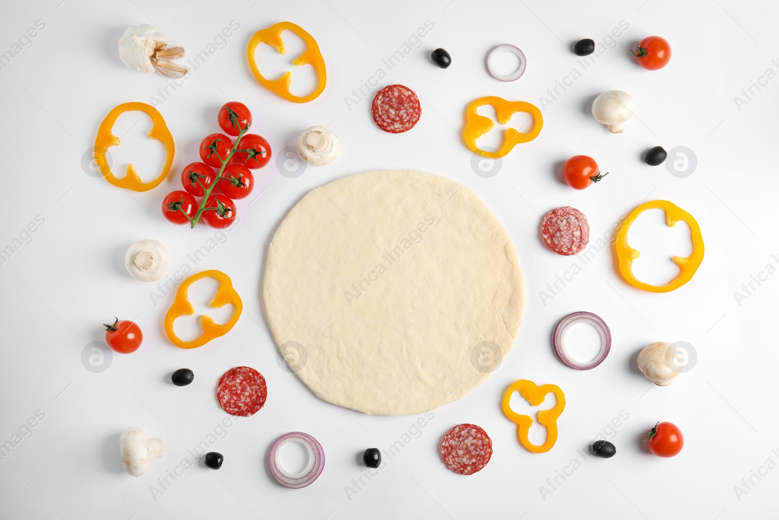 Photo of Flat lay composition with base and ingredients for pizza on white background