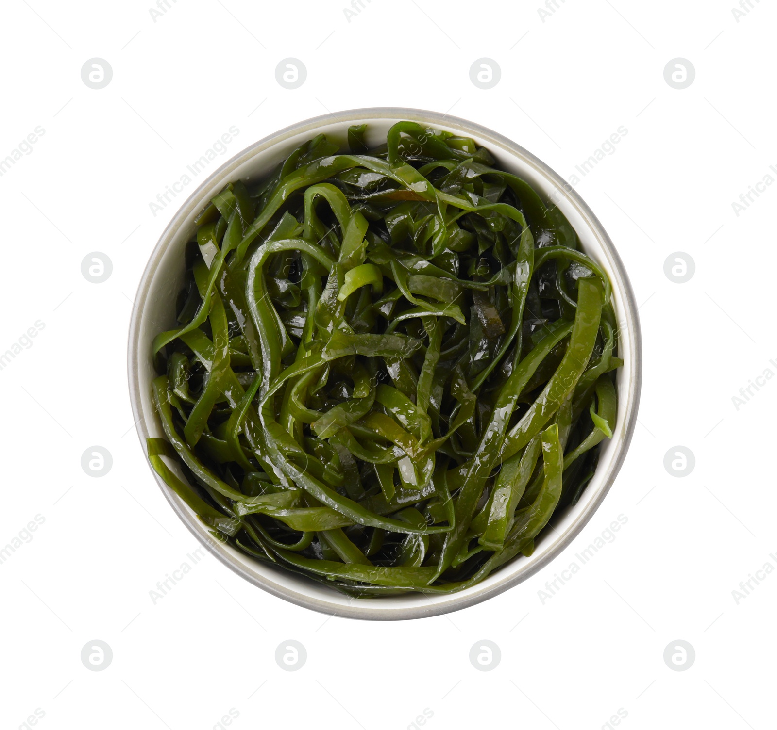 Photo of Tasty seaweed salad in bowl isolated on white, top view