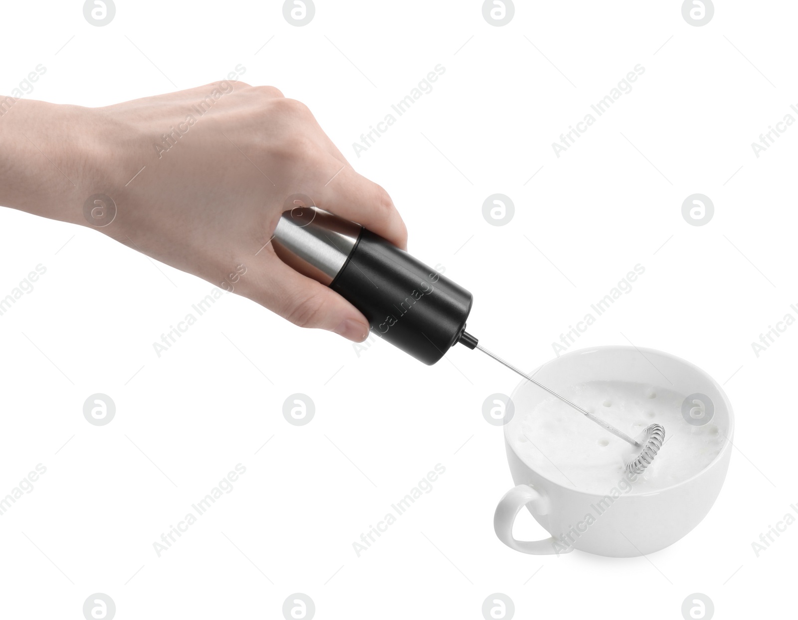 Photo of Woman whisking milk in cup with mini mixer (frother wand) isolated on white