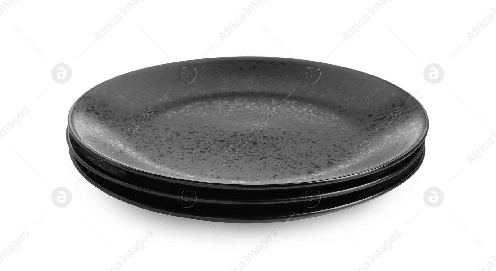 Photo of Three black ceramic plates isolated on white