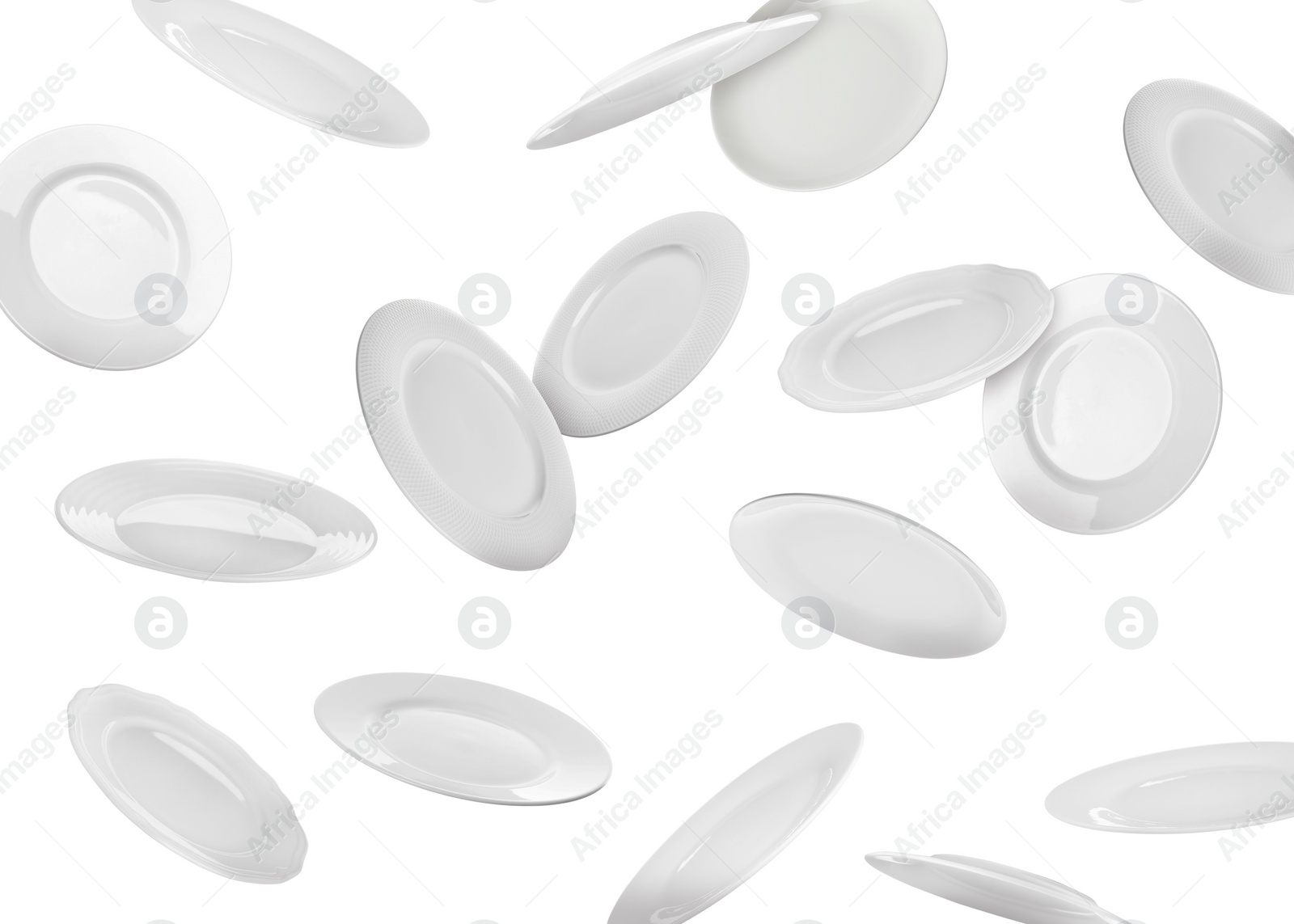 Image of Many ceramic plates falling on white background