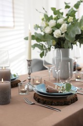 Festive table setting with beautiful tableware and decor indoors