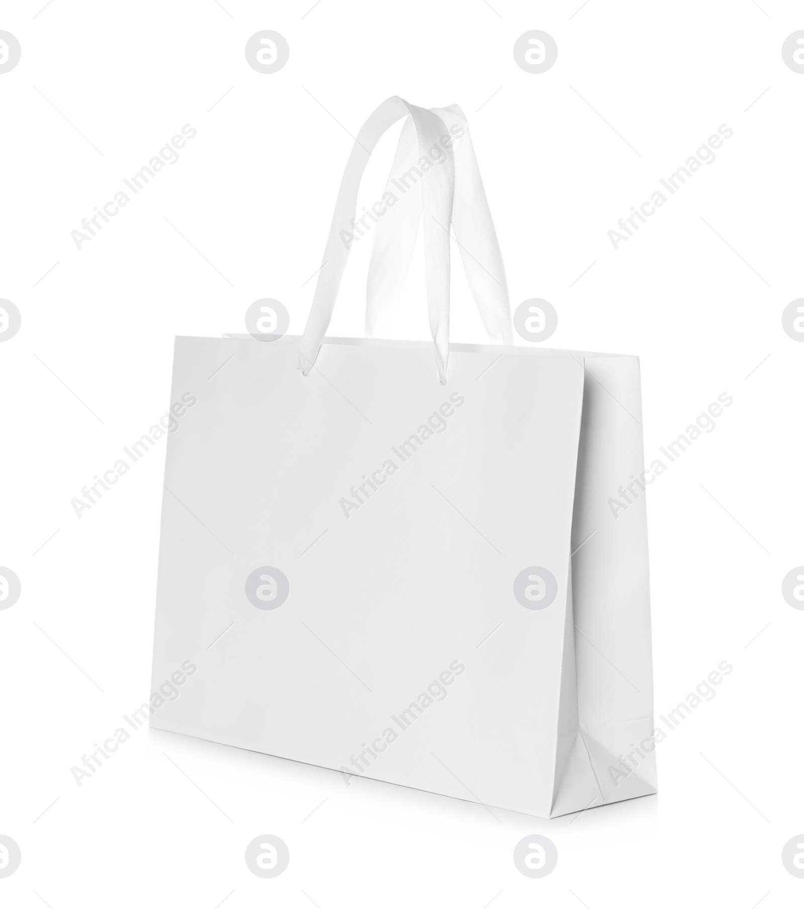 Photo of Paper shopping bag isolated on white. Mock up for design