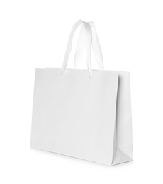 Photo of Paper shopping bag isolated on white. Mock up for design