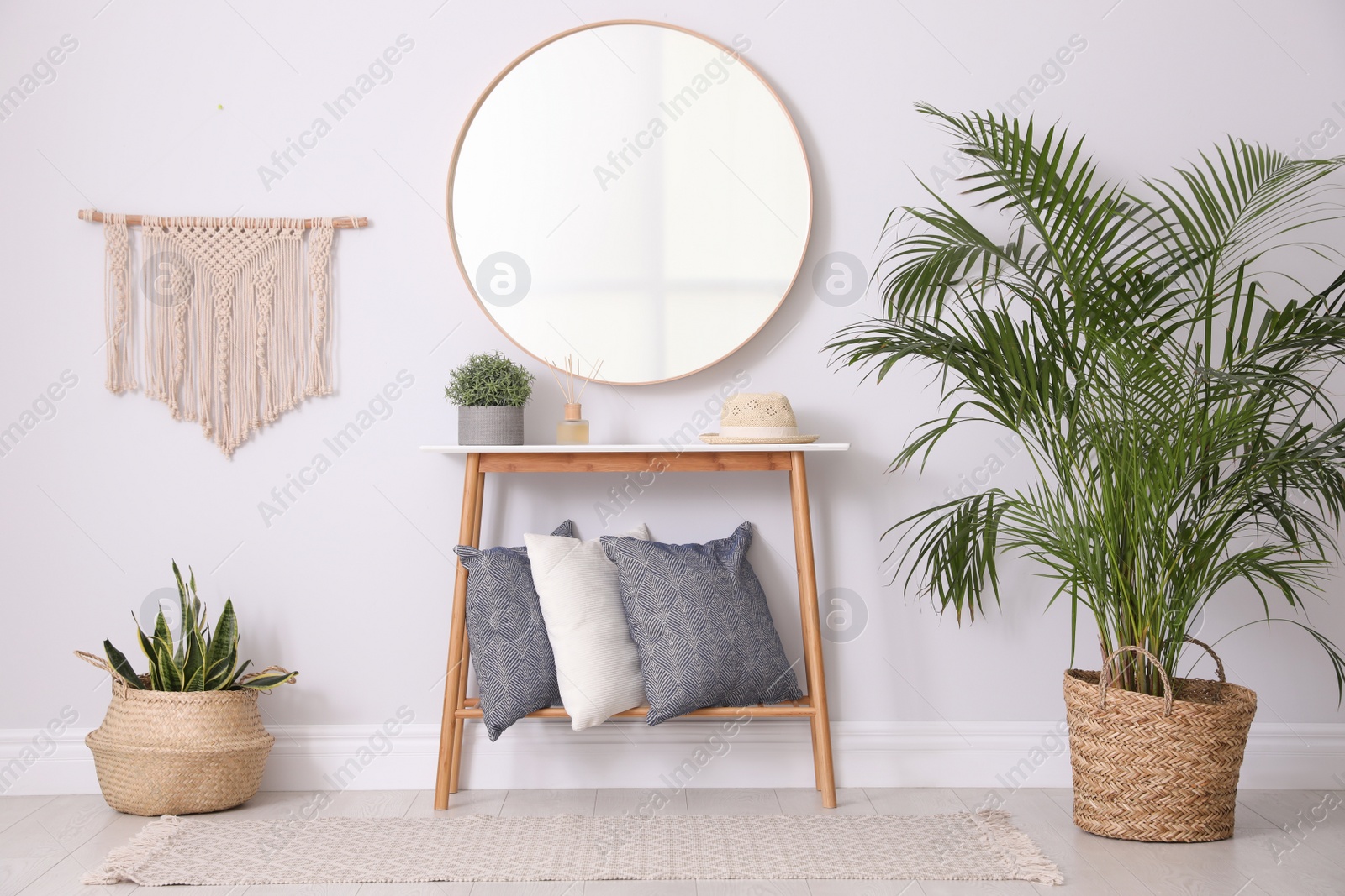 Photo of Round mirror and plants at home. Idea for interior design