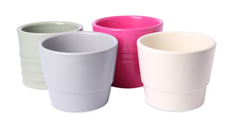 Photo of Many different empty ceramic flower pots on white background