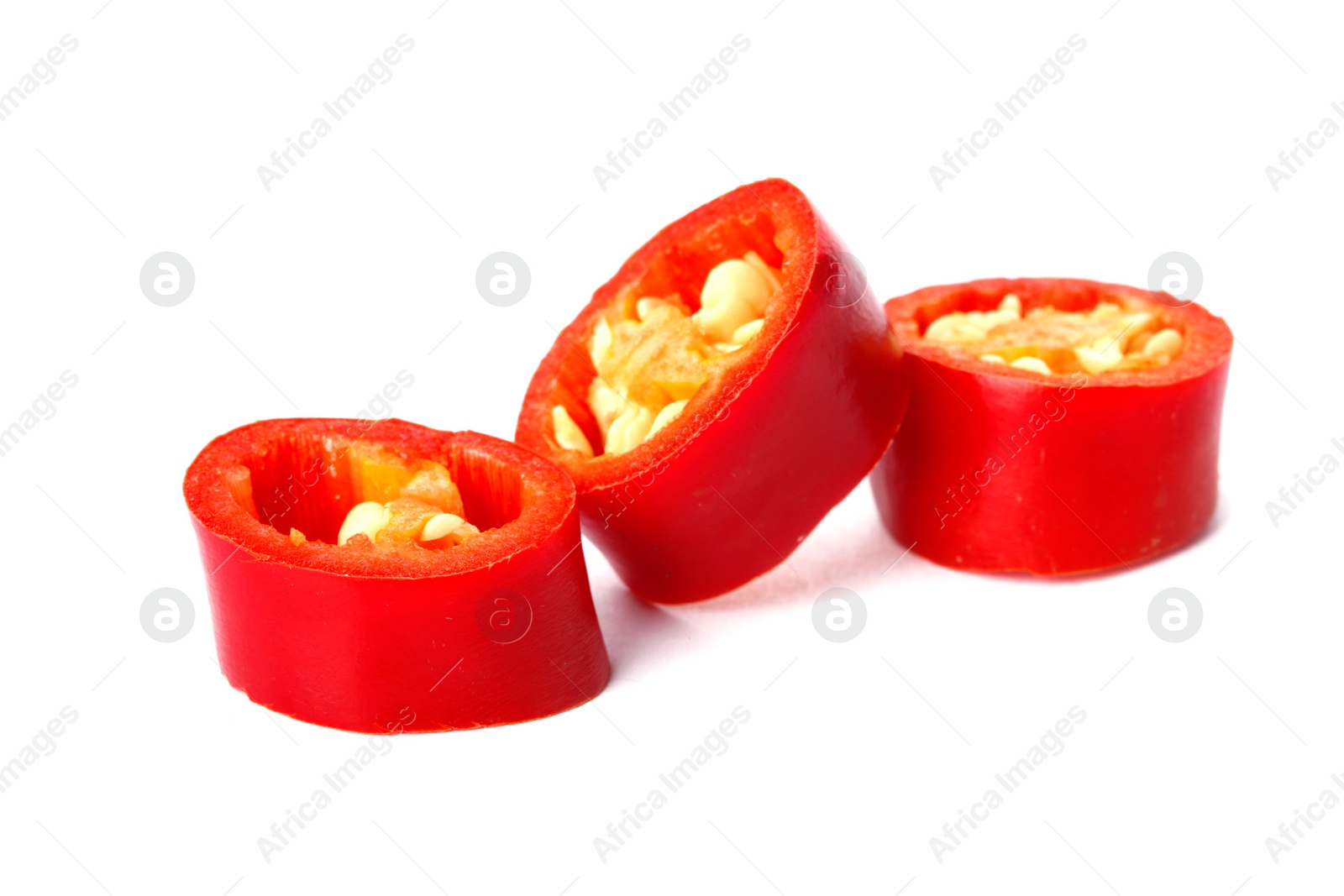 Photo of Slices of red chili pepper on white background