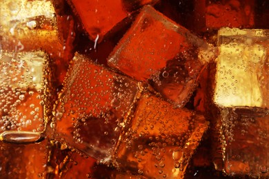 Photo of Closeup view of cold refreshing drink with ice in glass