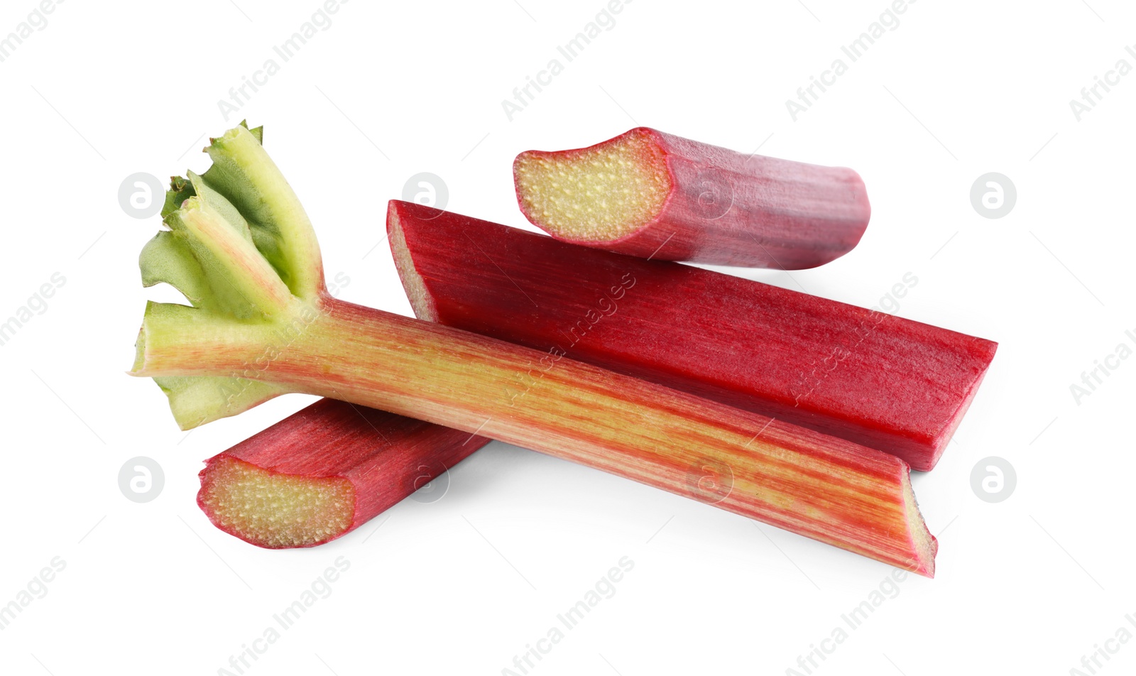 Photo of Stalks of fresh ripe rhubarb isolated on white