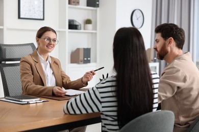 Couple having meeting with lawyer in office