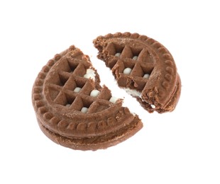 Broken tasty chocolate sandwich cookie with cream on white background