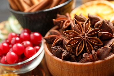 Photo of Dry anise stars in bowl, closeup. Mulled wine ingredient