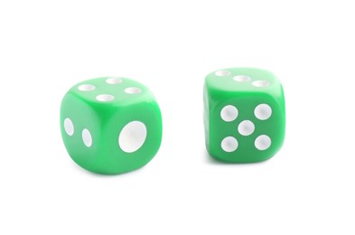 Photo of Two green game dices isolated on white